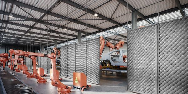 Acoustic baffles hanging from warehouse ceiling